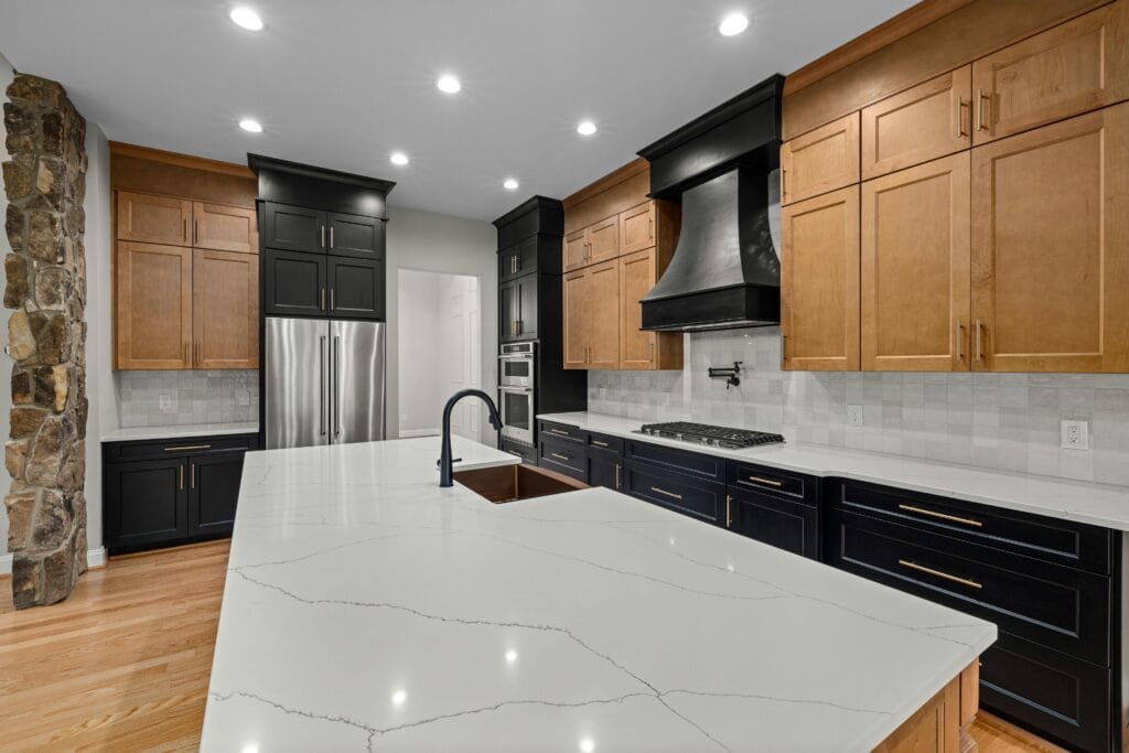 Calacatta quartz slab with bold grey veining on a bright white field