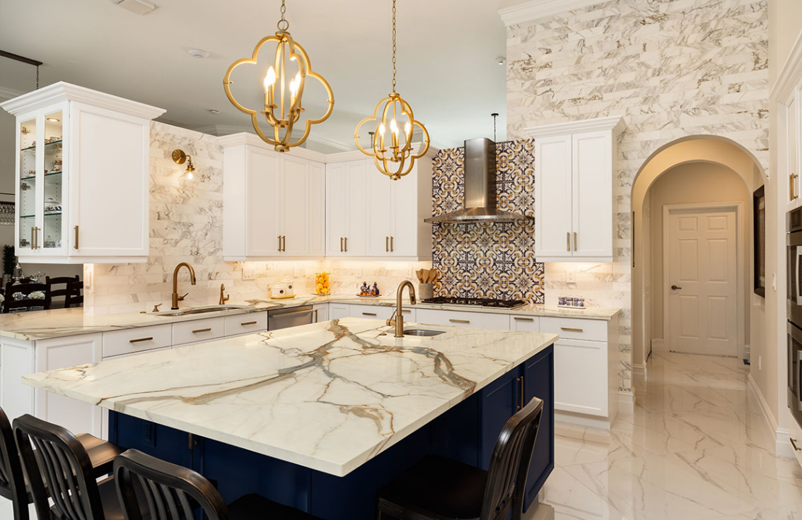 Kitchen renovated with Calacatta quartz countertops and island